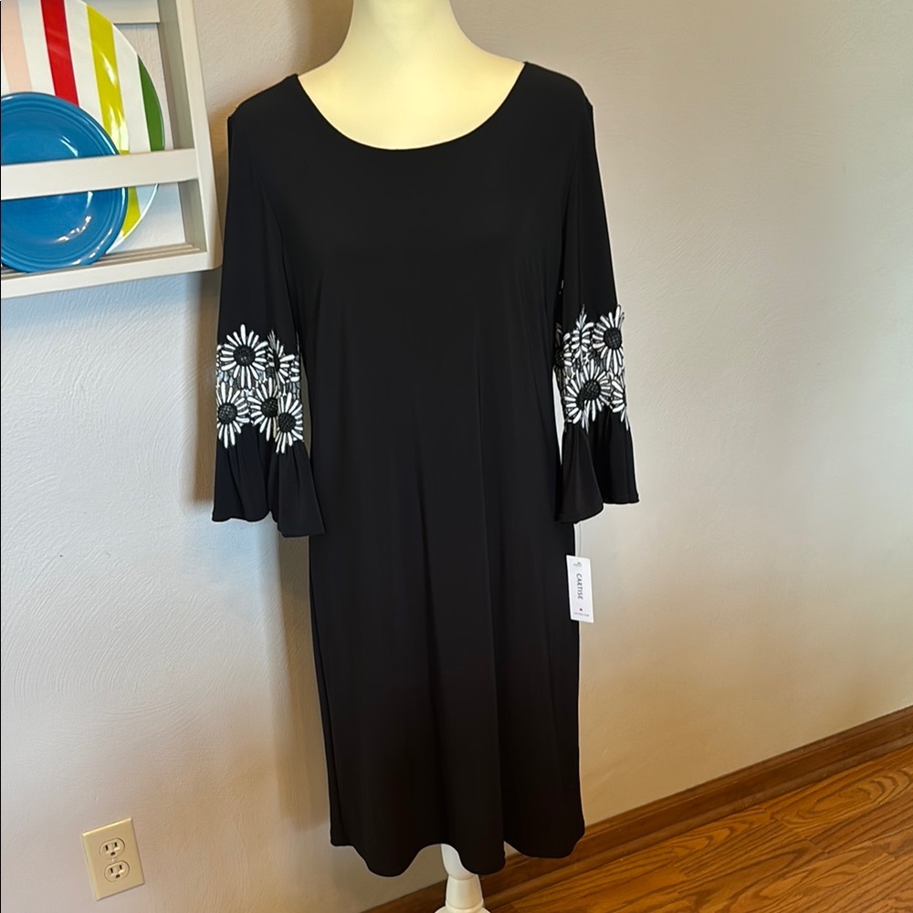 Elegant Black Dress with White Floral Accent on sleeves